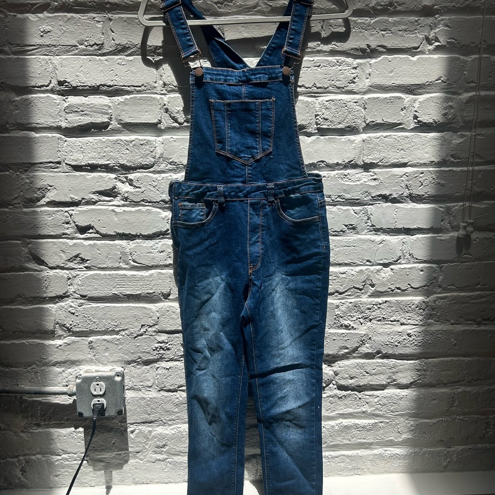Blue Denim Jumpsuit with Natural Fading and Distressing